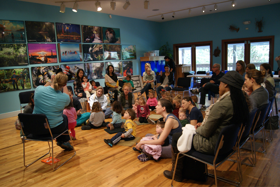 classroom filled with toddlers being read to.